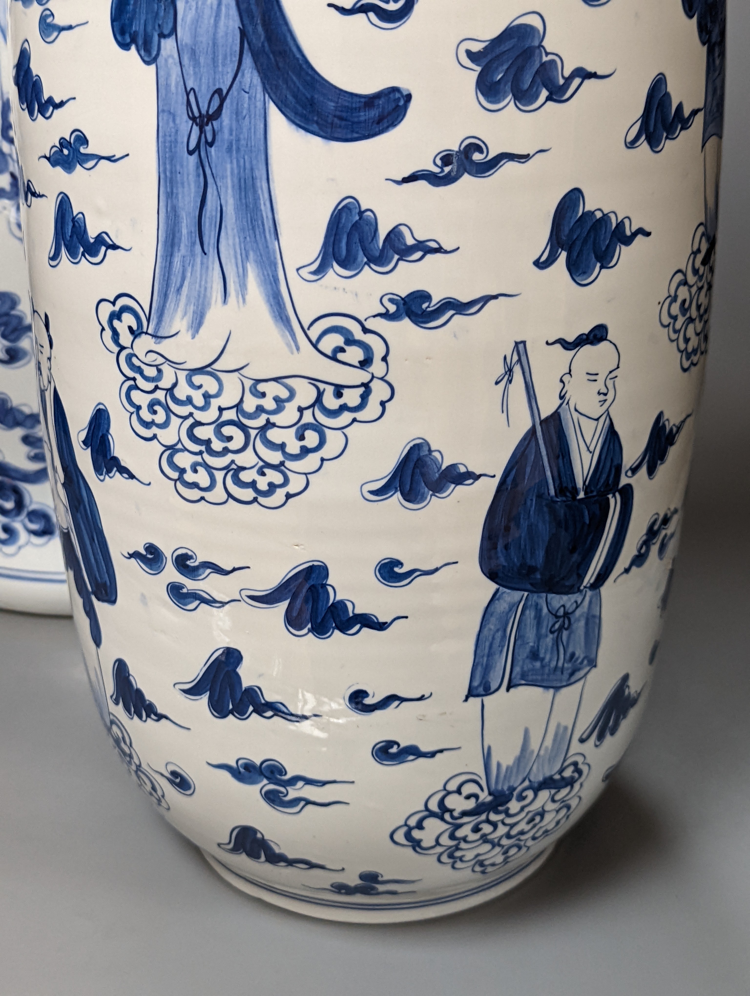 A large Chinese blue and white baluster jar and cover and matching vase, tallest 55 cms high.